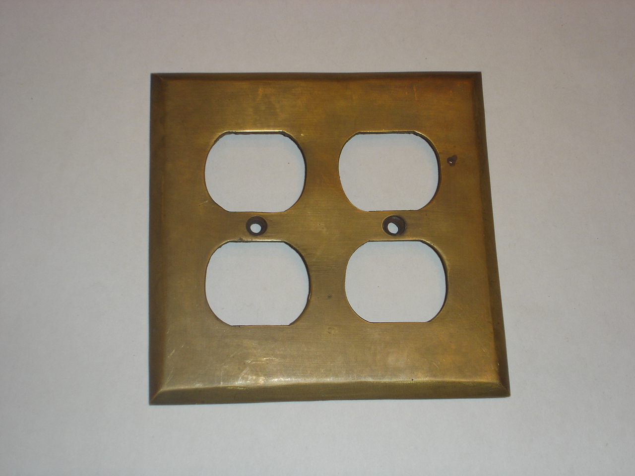 Brass switch cover Code AE.053 size  116 x 114 mm.